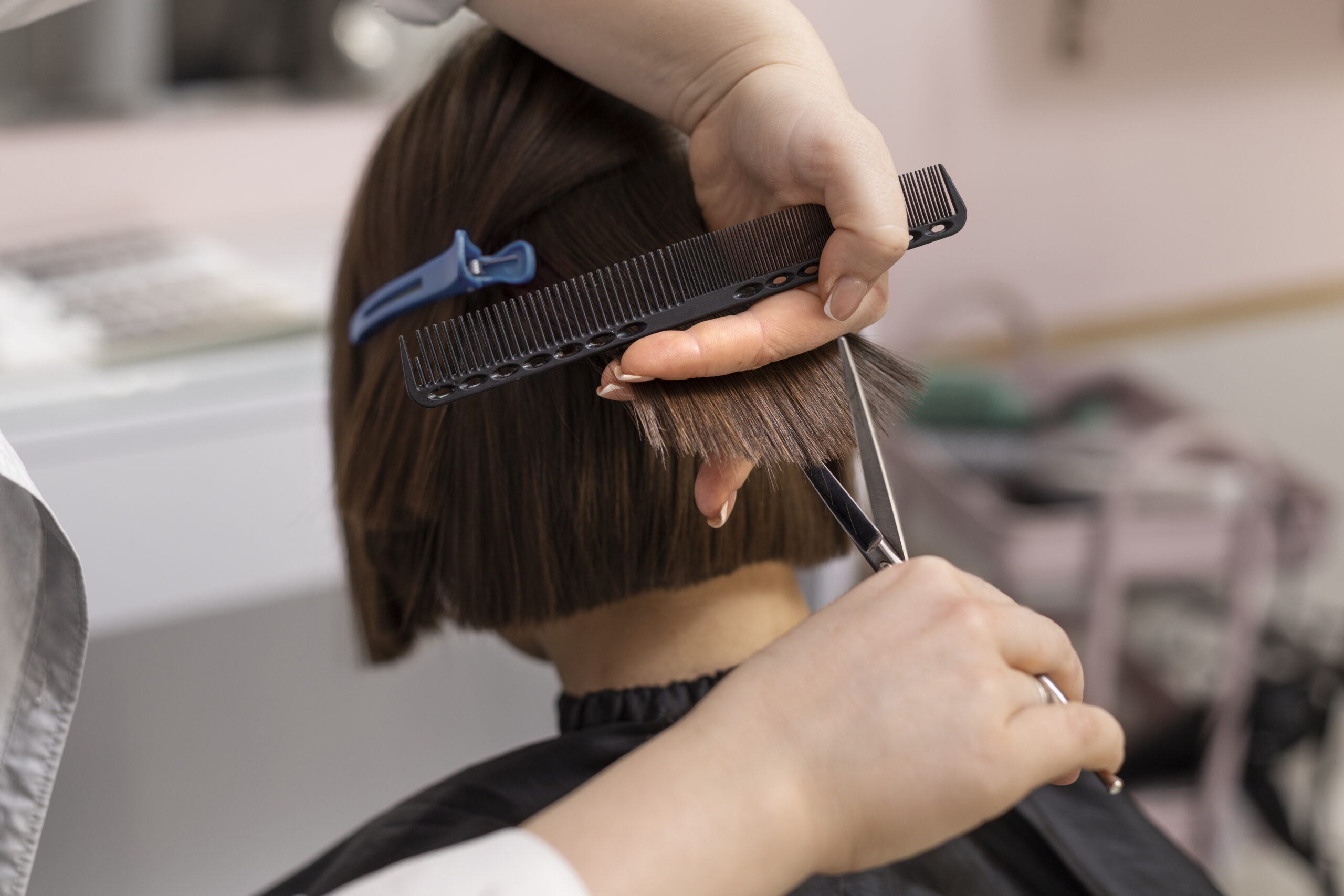 woman-getting-treatment-hairdresser-shop